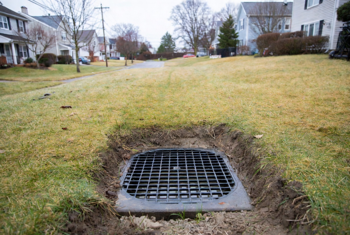 drainage catch basin integrated into a residential lawn