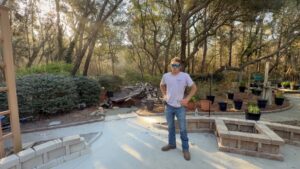 curved seat wall taking shape with gravel base installed in the patio field