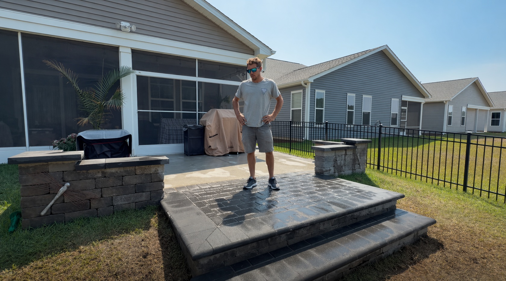 Custom charcoal gray paver landing and steps with full-nose coping installed by Precision Hardscape and Construction in the Myrtle Beach area
