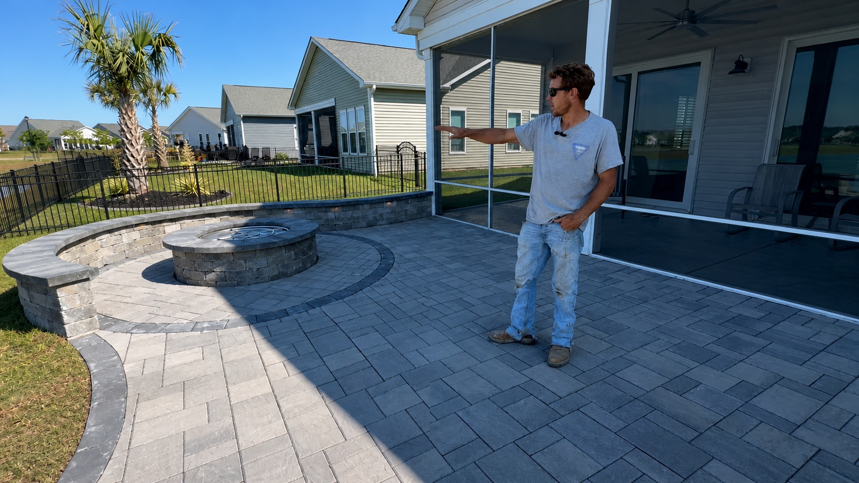 Overhead view of completed 550 sq ft paver patio with curved seat walls and fire pit installed by Precision Hardscape & Construction in coastal Carolina