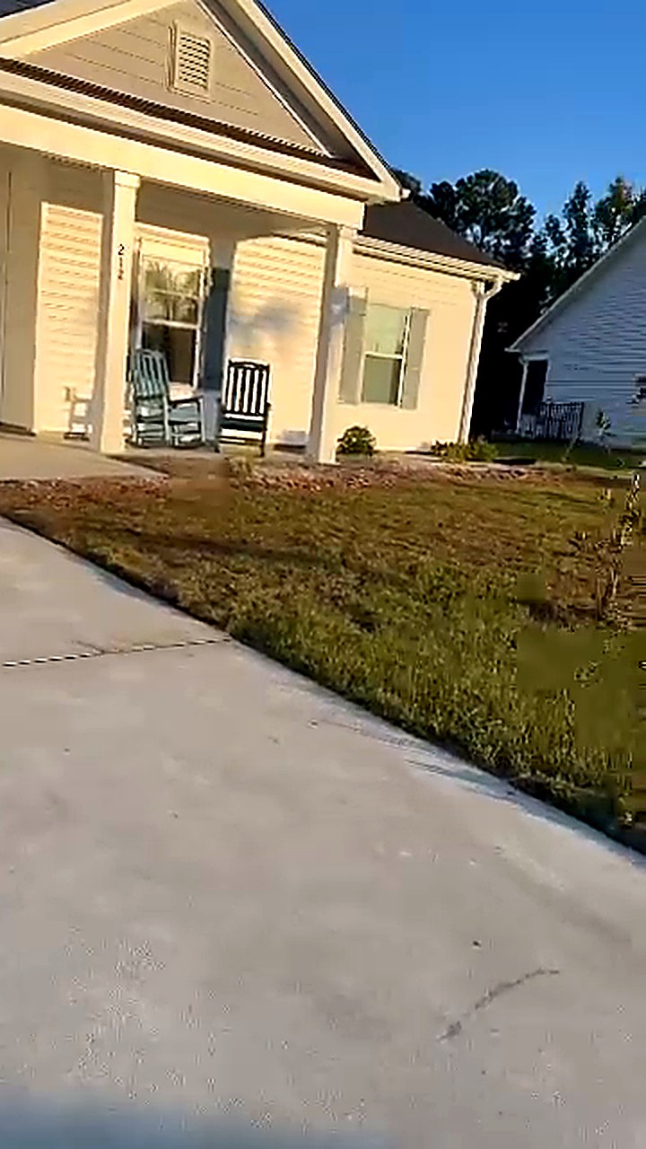 New sod laid along a front walkway and around a porch at a home in Conway South Carolina