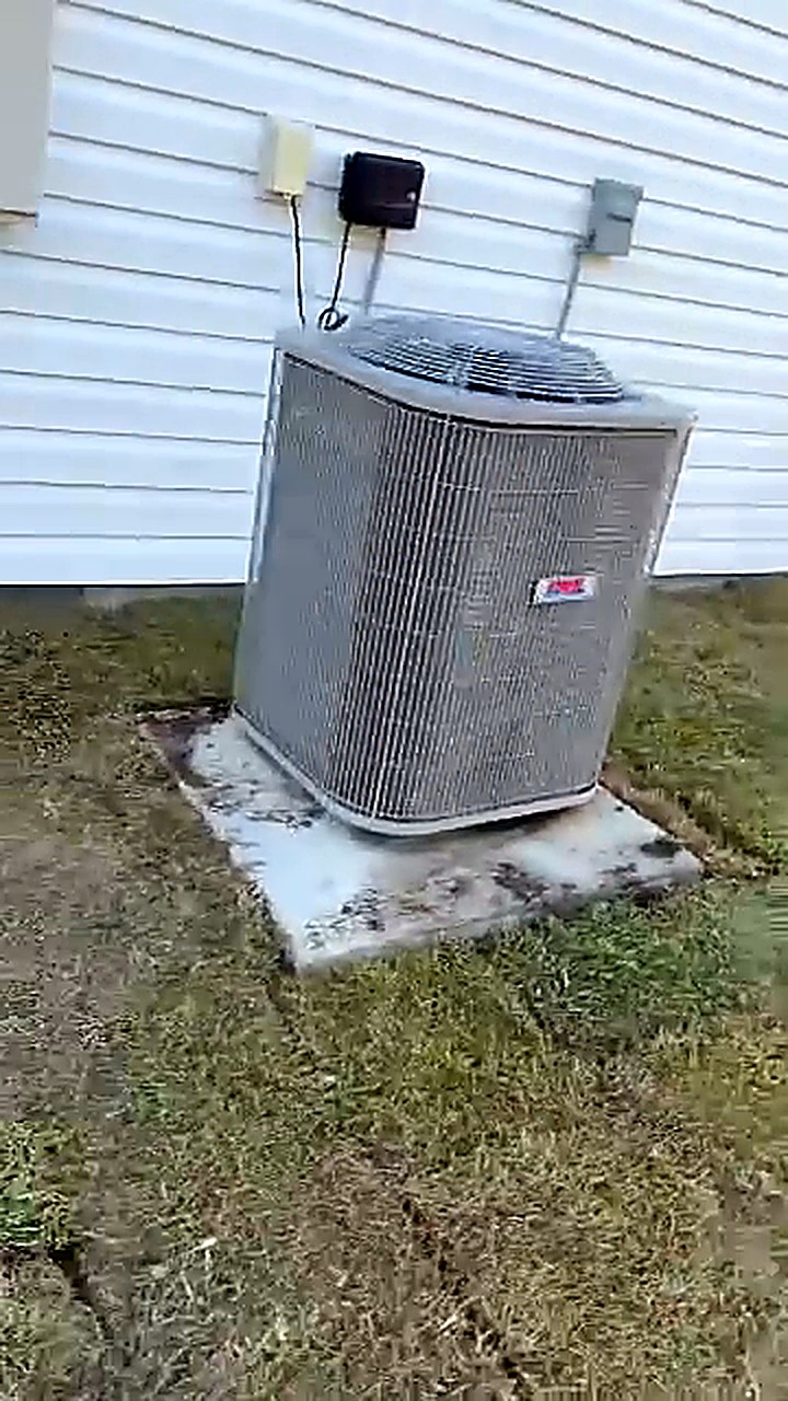 New sod laid neatly around an outdoor air conditioning condenser unit at a home in Conway South Carolina