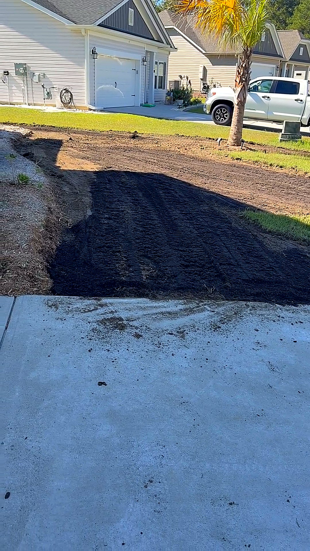 Lawn area stripped of old sod with fresh soil brought in and graded ready for new sod installation